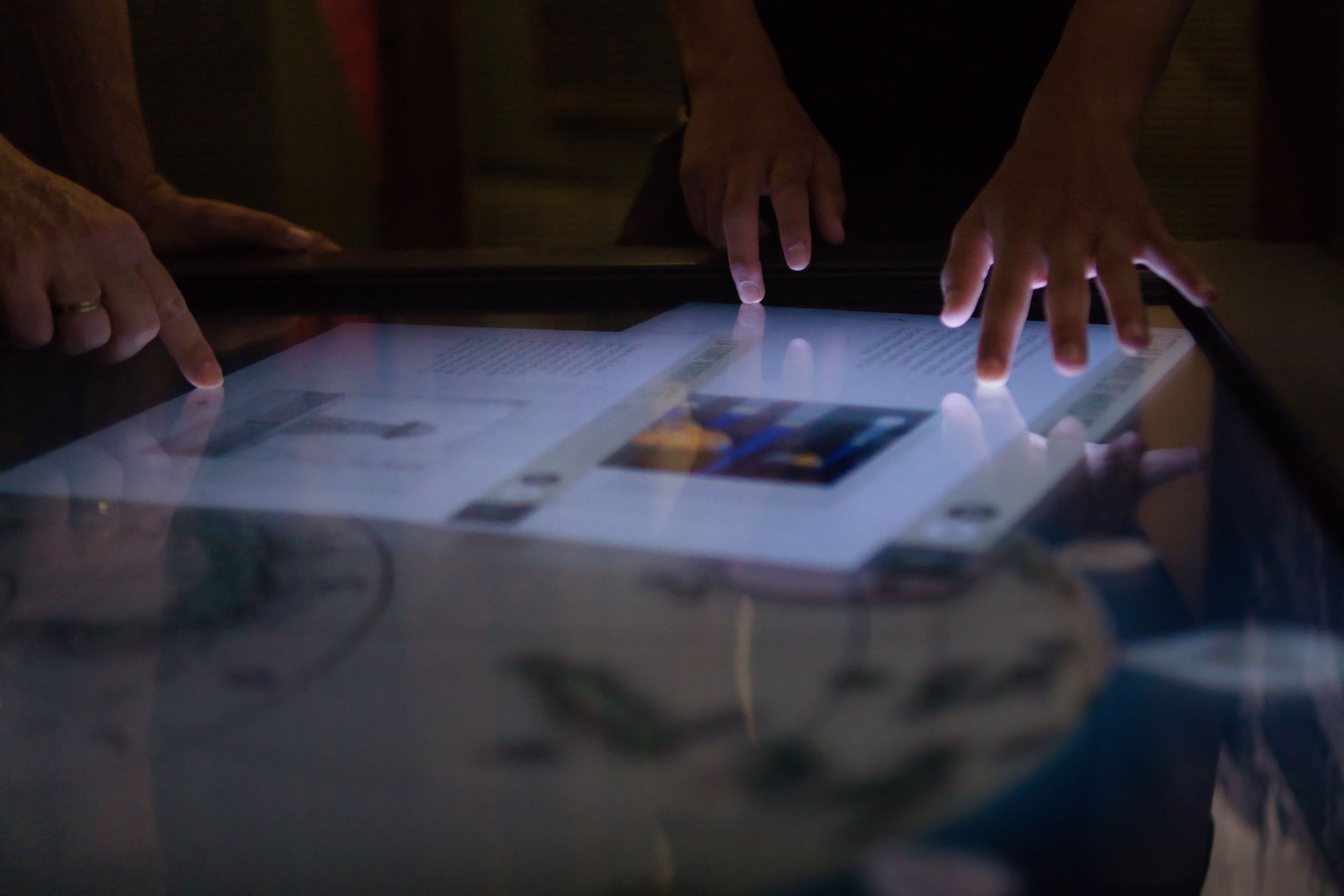Hands Touching an Interactive Screen